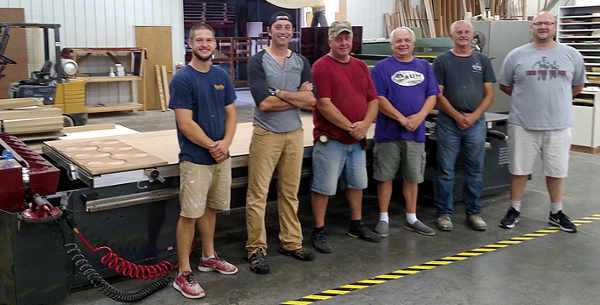 Matt Schiller of AUM Wood Products with his employees and their new Thermwood Cut Ready Cut Center