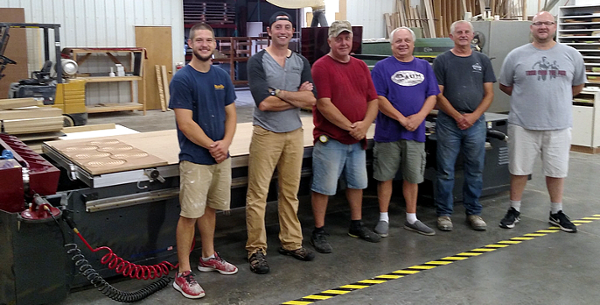 Matt Schiller of AUM Wood Products with his employees and their new Thermwood Cut Ready Cut Center 