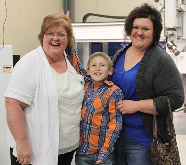 Becky, grandson Gavin and daughter Michelle Kieper being silly at the luncheon